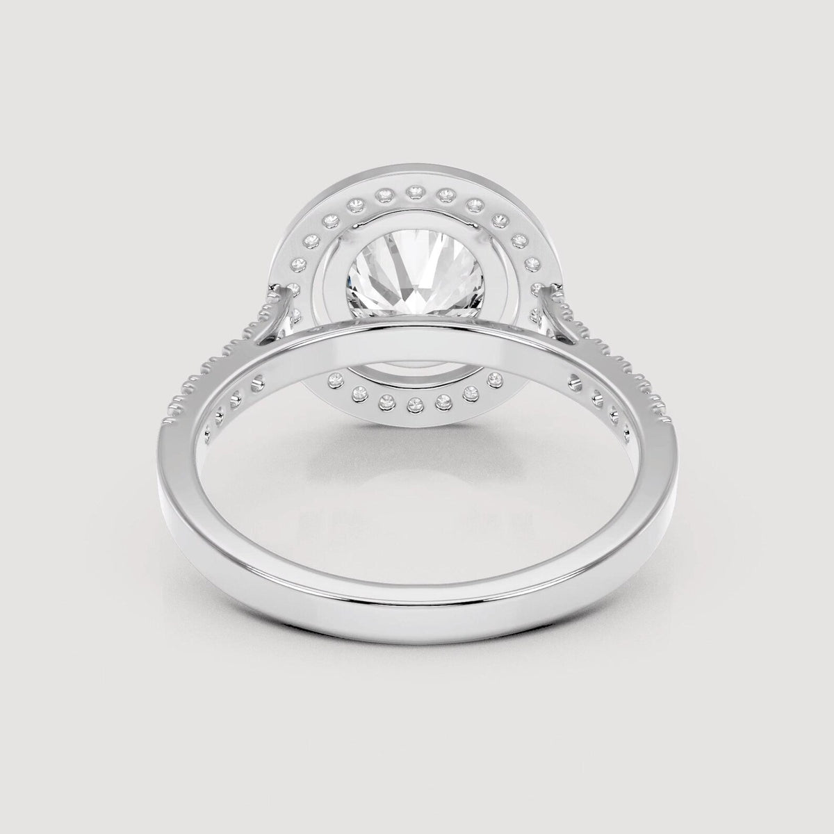 Underside view of basket setting on a 4 CT round lab diamond halo ring in white gold.
