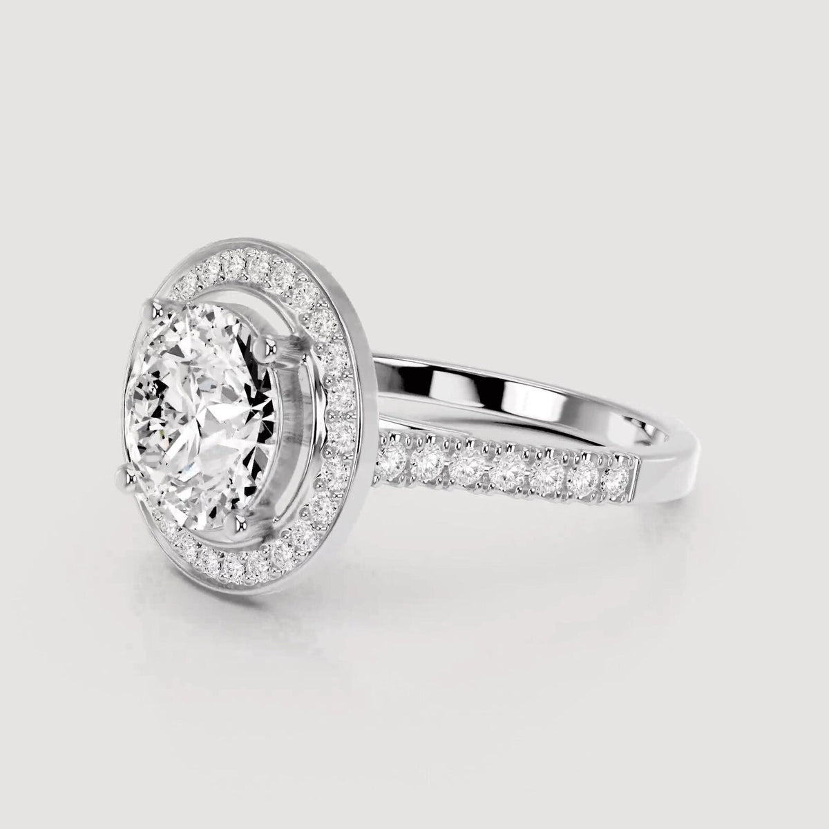 3/4 front view highlighting halo setting on 4 CT round lab diamond ring in white gold.