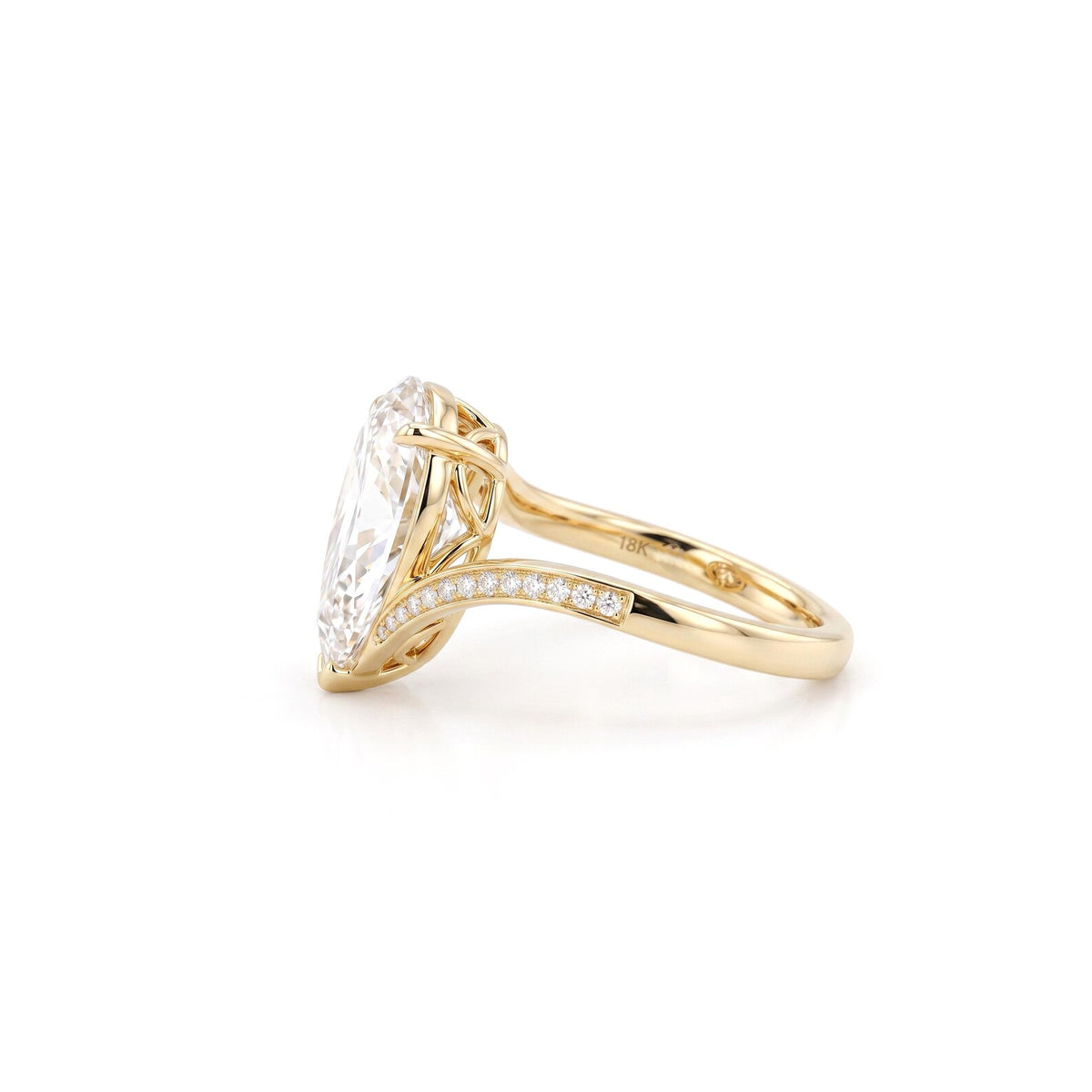 Side profile view of 3 Carat Pear Cut Lab Diamond Ring in 18K Yellow Gold showing basket setting and pavé curve