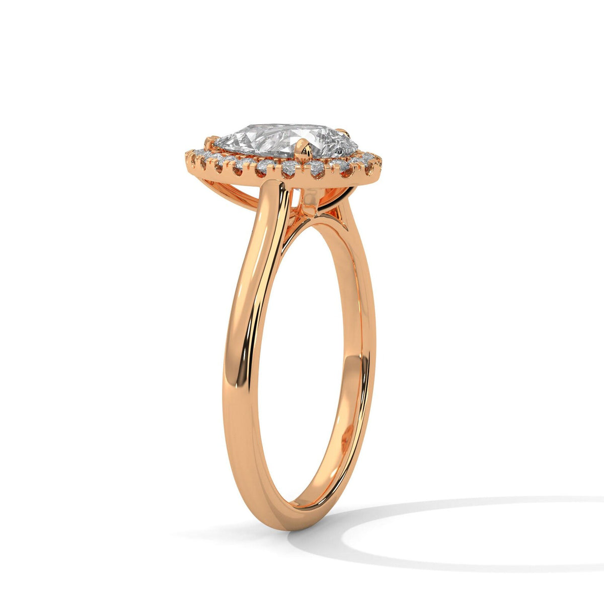 Side perspective view of 3 Carat Pear Cut Lab Grown Diamond Halo Engagement Ring in Rose Gold with plain band