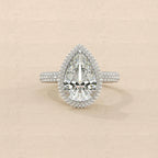 Top-down view of 4 Carat Pear Cut Lab Grown Diamond Engagement Ring with double halo and multi-row pave band in white gold