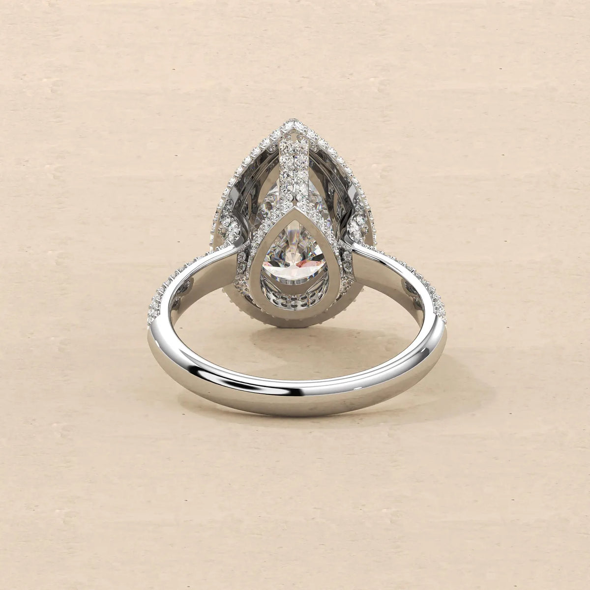 Underside structural view of 4 Carat Pear Cut Lab Grown Diamond Ring showing under-halo gallery and interior band structure