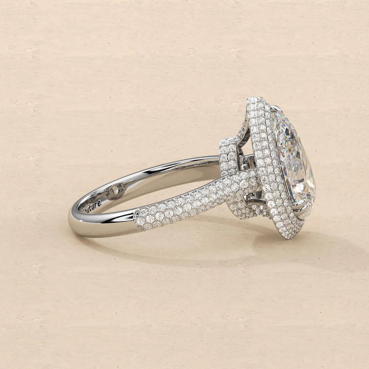 Right side profile view displaying multi-row pave band and diamond-encrusted basket head of 4 Carat Pear Diamond Ring