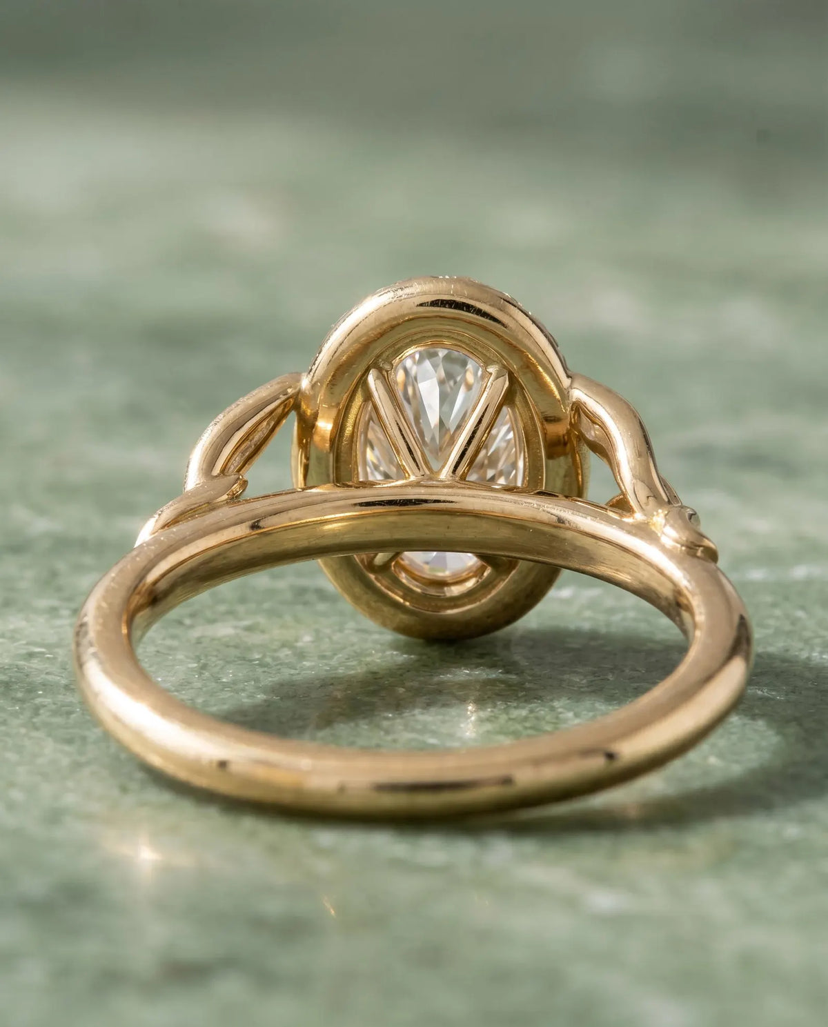 Rear view showing oval basket setting and interior band design of 2 Carat Oval Lab Diamond Botanical Ring in yellow gold