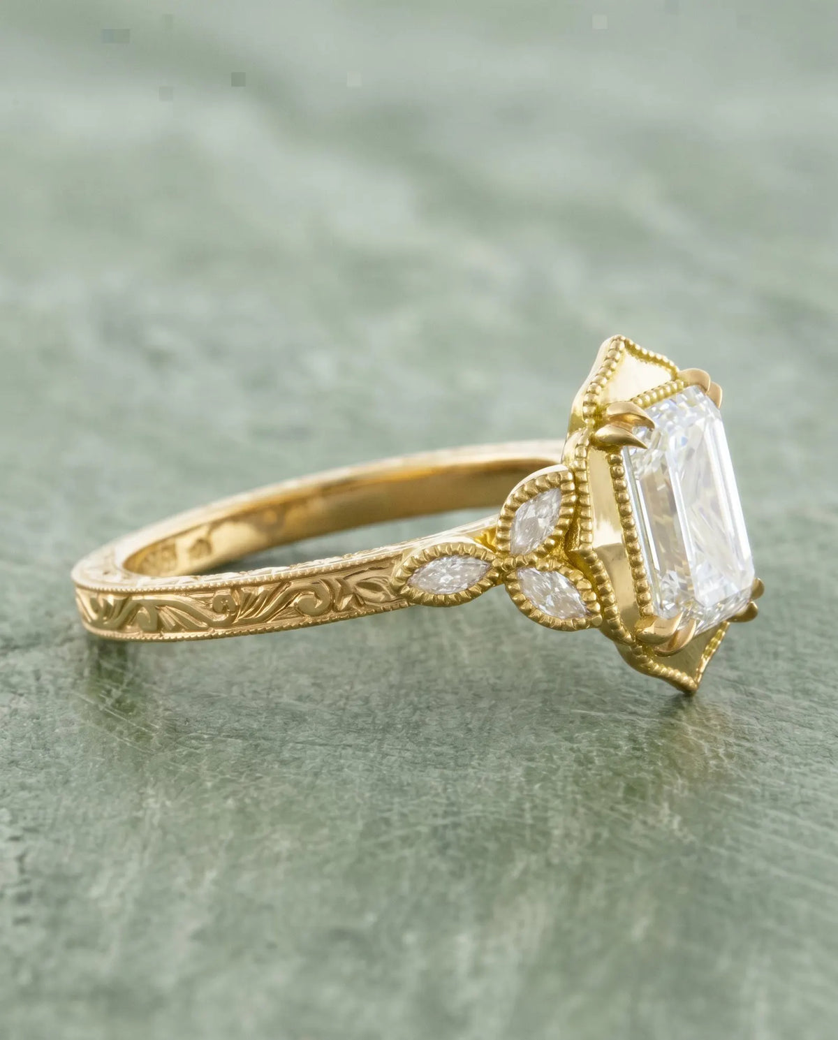 Side profile angle highlighting marquise accent stones and hand-engraved vintage shank of 3 Carat Emerald Cut Lab Diamond Ring
