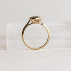 High-angle perspective view of 2 Carat Oval Cut Lab Grown Diamond Ring with smooth bezel setting and star-etched shoulder