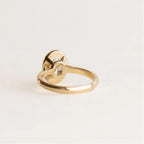 Underside view of 2 Carat Oval Cut Lab Diamond Ring highlighting the open back bezel setting and solid gold band