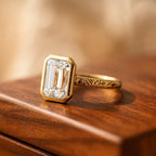 Angled perspective view of 3 Carat Emerald Cut Lab Grown Diamond Ring featuring milgrain bezel and engraved band