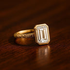 Close-up view of 3 Carat Emerald Cut Lab Grown Diamond showing step-cut facets and milgrain inner bezel border