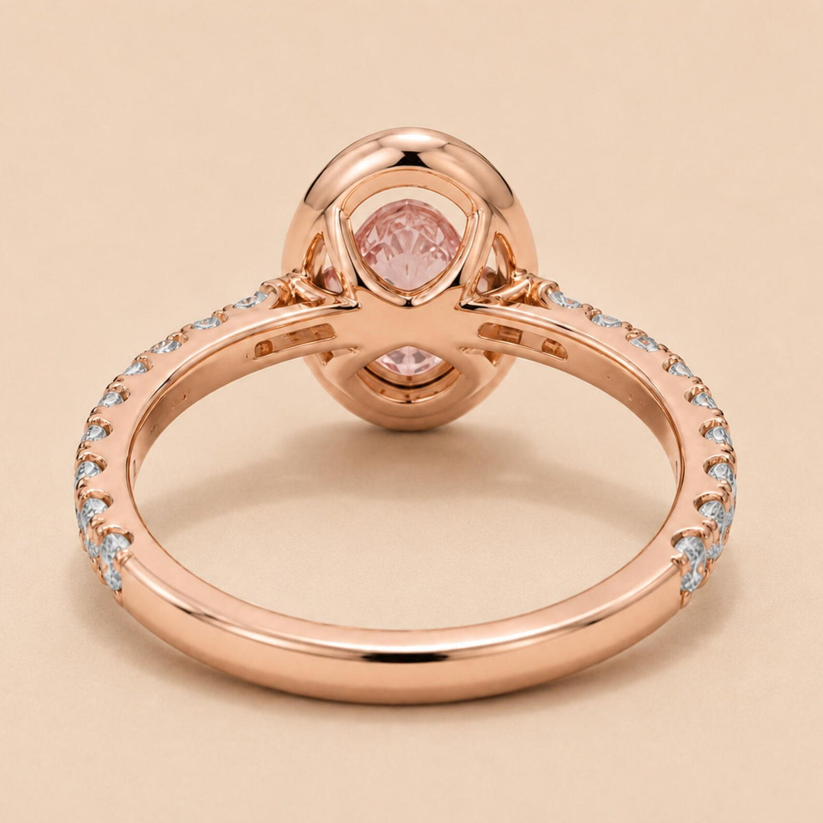 Underside view of 2 Carat Pink Oval Cut Lab Diamond Ring showing open bridge basket and rose gold pave band