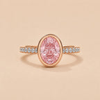 Top-down front view of 2 Carat Pink Oval Cut Lab Grown Diamond Bezel Ring with pave diamond band