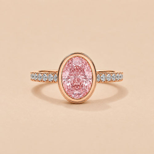 Top-down front view of 2 Carat Pink Oval Cut Lab Grown Diamond Bezel Ring with pave diamond band