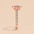 Vertical side view of 2 Carat Pink Oval Cut Lab Diamond Bezel Ring showcasing pave diamond band profile