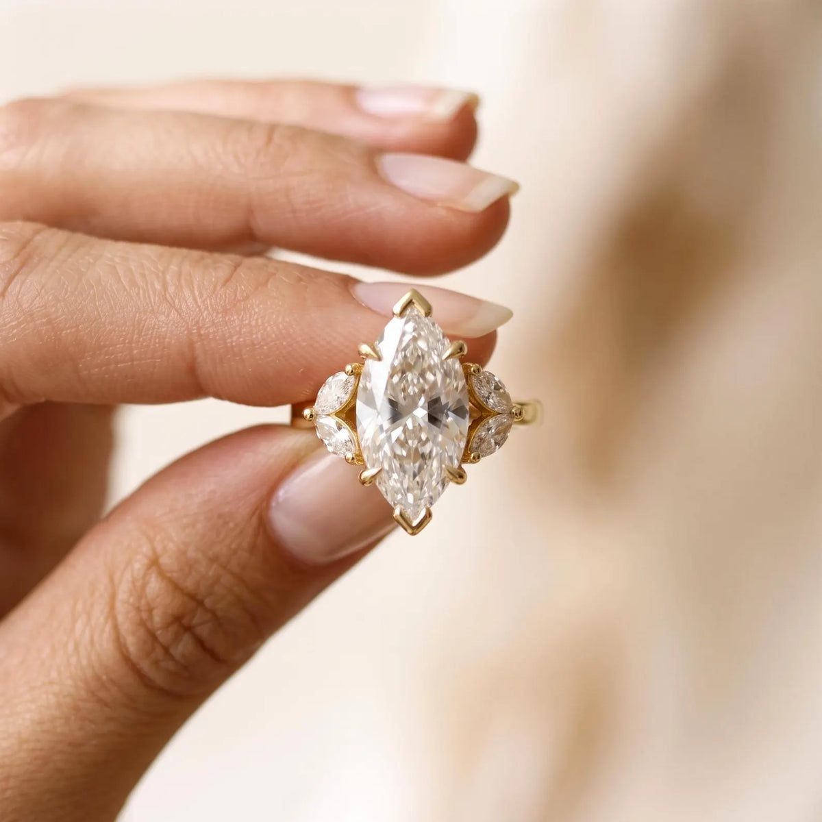 On-hand view of 4 Carat Marquise Cut Lab Grown Diamond Engagement Ring with botanical marquise side stones