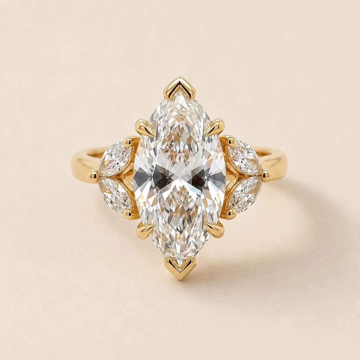 Top-down studio view of 4 Carat Marquise Cut Lab Grown Diamond Ring with marquise leaf side stone clusters in yellow gold
