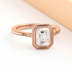 Angled view of 3 Carat Emerald Cut Lab Diamond Ring in rose gold showing milgrain bezel setting and diamond accent band
