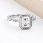 Angled perspective view of 3 Carat Emerald Cut Lab Grown Diamond Ring in white gold featuring milgrain detailing