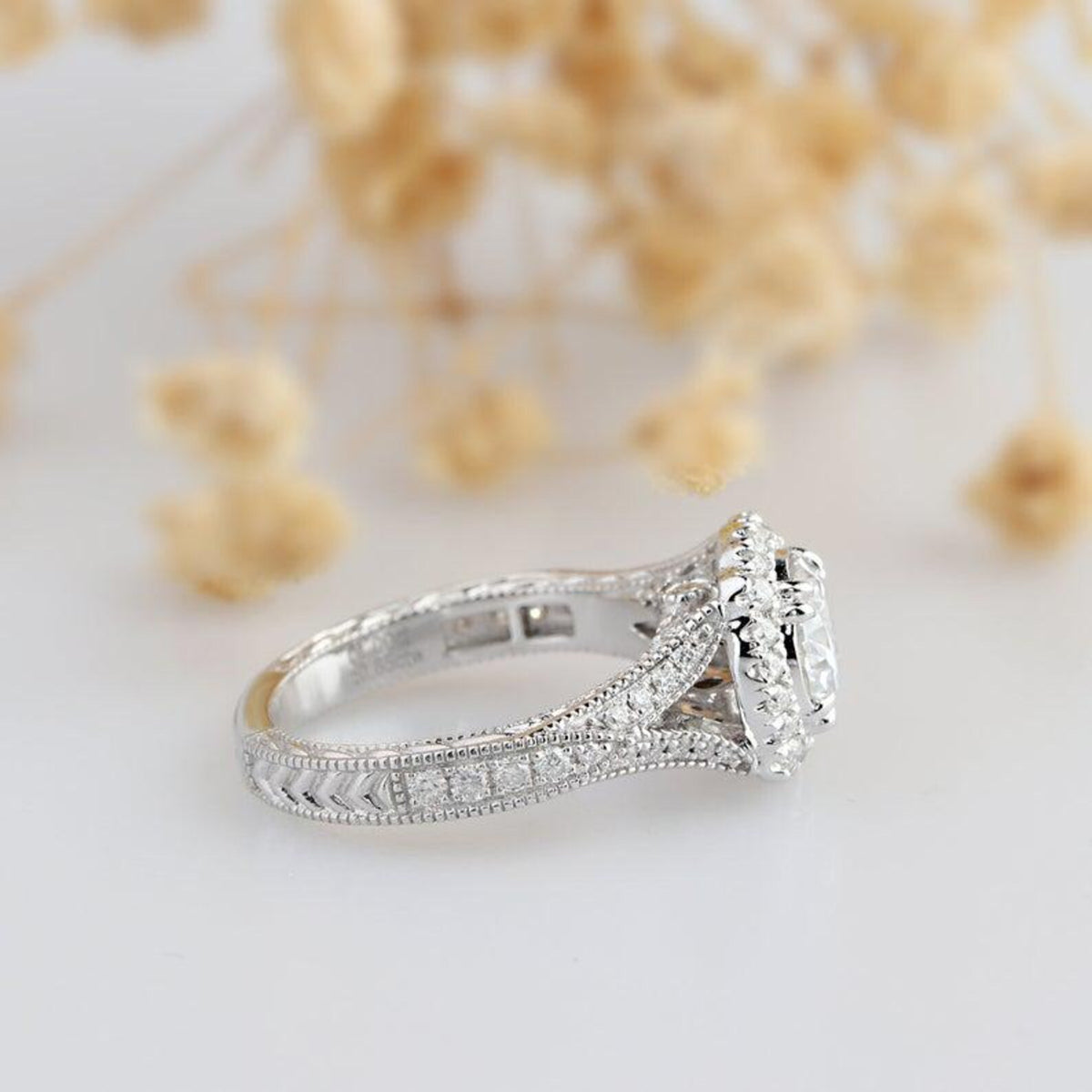 Side profile view of 3 Carat Round Cut Lab Diamond Ring displaying pavé split shank and vintage engraving