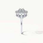 Side profile view of a 3 carat round cut lab grown diamond engagement ring with an elevated floral basket setting in white gold.