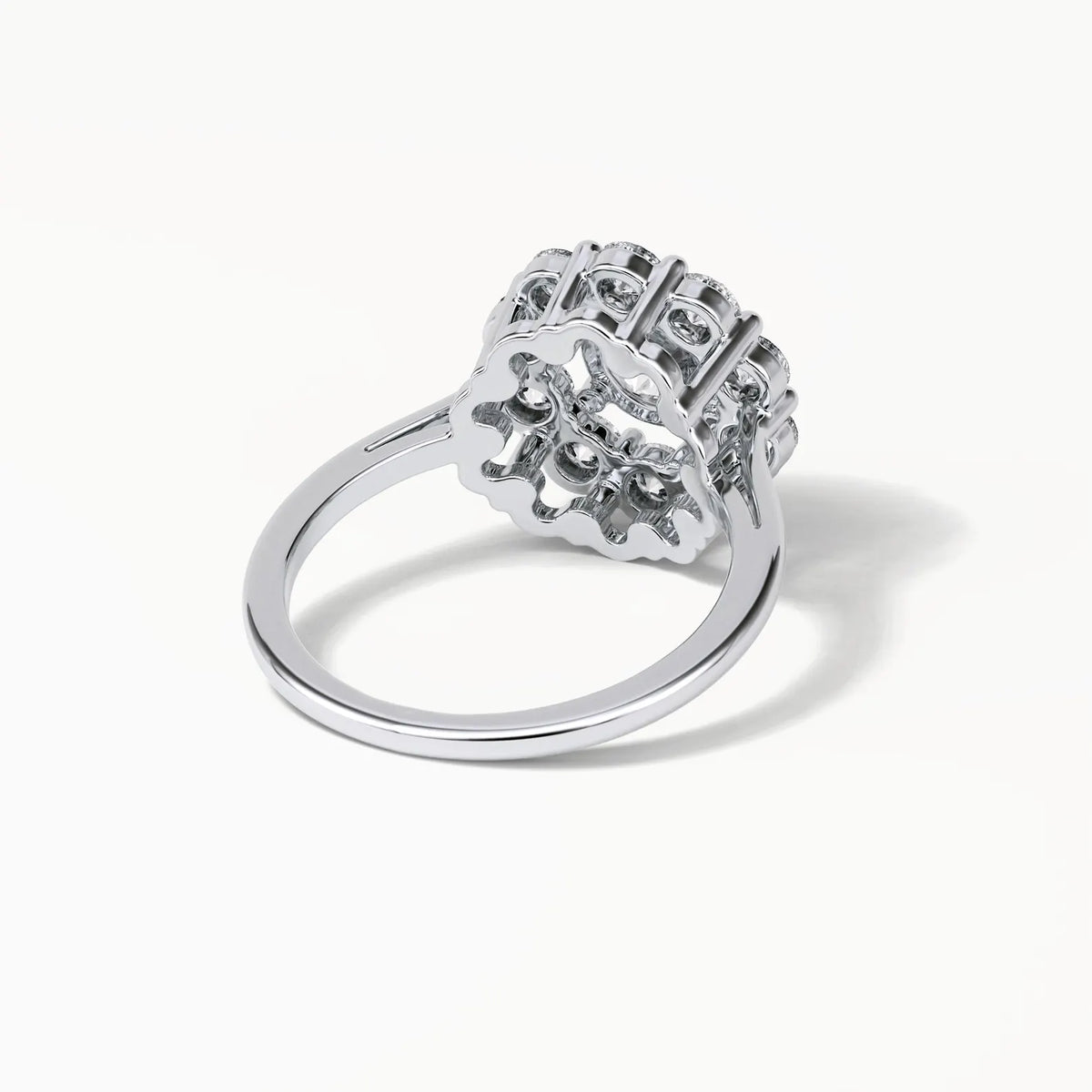 Bottom perspective view highlighting the openwork scalloped lattice basket structure under the lab grown diamond setting.