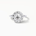 Top-down bird's-eye view of a brilliant 3 CT round lab diamond surrounded by a flower-shaped halo of accent diamonds.