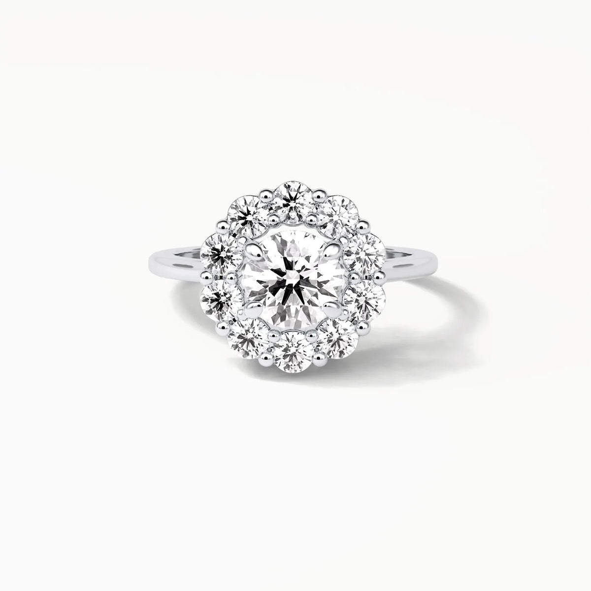 Top-down bird's-eye view of a brilliant 3 CT round lab diamond surrounded by a flower-shaped halo of accent diamonds.