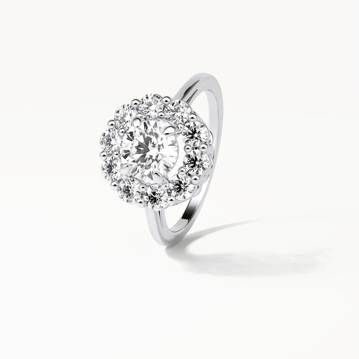 Angled perspective shot showing the sparkle and fire of the 3 carat round lab diamond blooming halo ring.