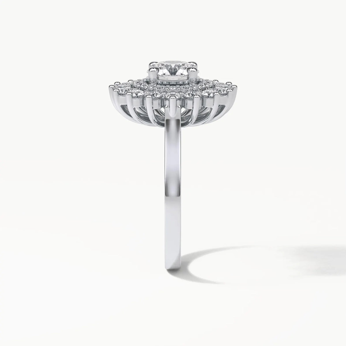 Profile view of a 3 carat round lab grown diamond engagement ring with a sunburst double halo and wirework gallery.