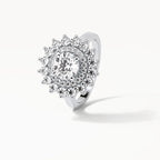 Angled top view displaying the brilliance of a 3 CT round center diamond surrounded by a double starburst halo.