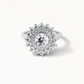 Direct top-down view of a 3 CT round cut lab grown diamond in a multi-tier sunburst double halo mounting.