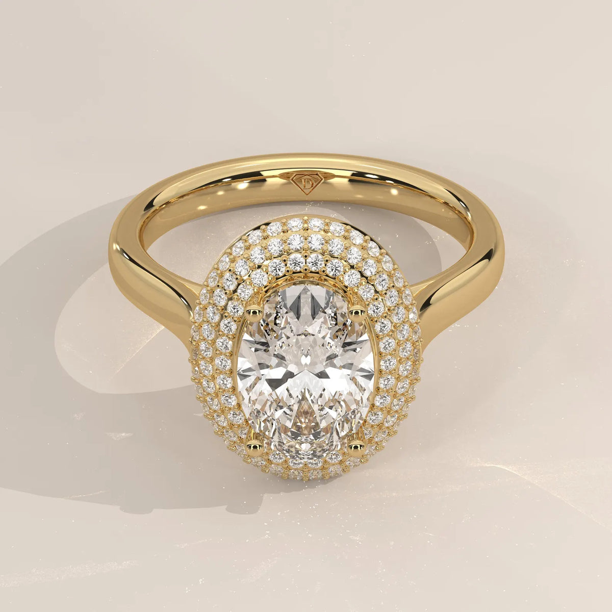Detailed close up view of a 3 CT oval cut lab grown diamond held by four prongs and surrounded by three rows of pave accent diamonds.