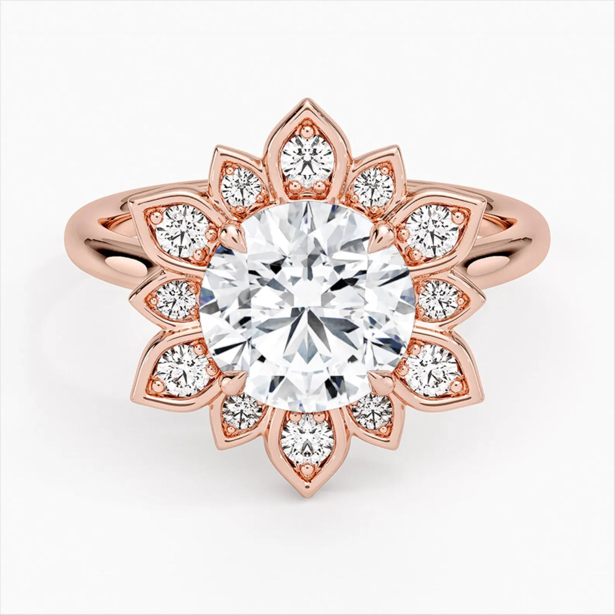 Direct top view of a 3 CT round brilliant lab grown diamond engagement ring with a starburst petal halo set in rose gold.