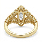 Bottom undergallery view showcasing openwork filigree scroll detailing beneath a 3 carat marquise lab diamond setting.