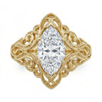 Direct overhead view of a 3 carat marquise cut lab grown diamond in a wide vintage scrollwork filigree frame.