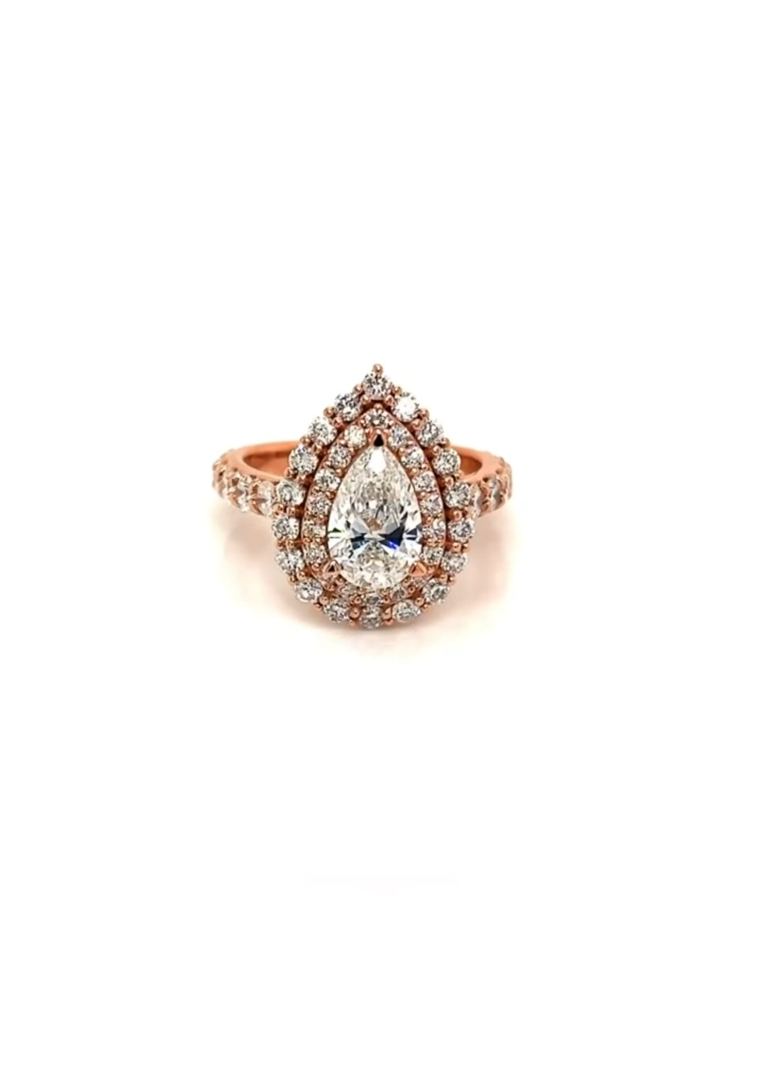 Top-down view of a 2 carat pear shaped lab grown diamond surrounded by a double diamond halo set in rose gold.