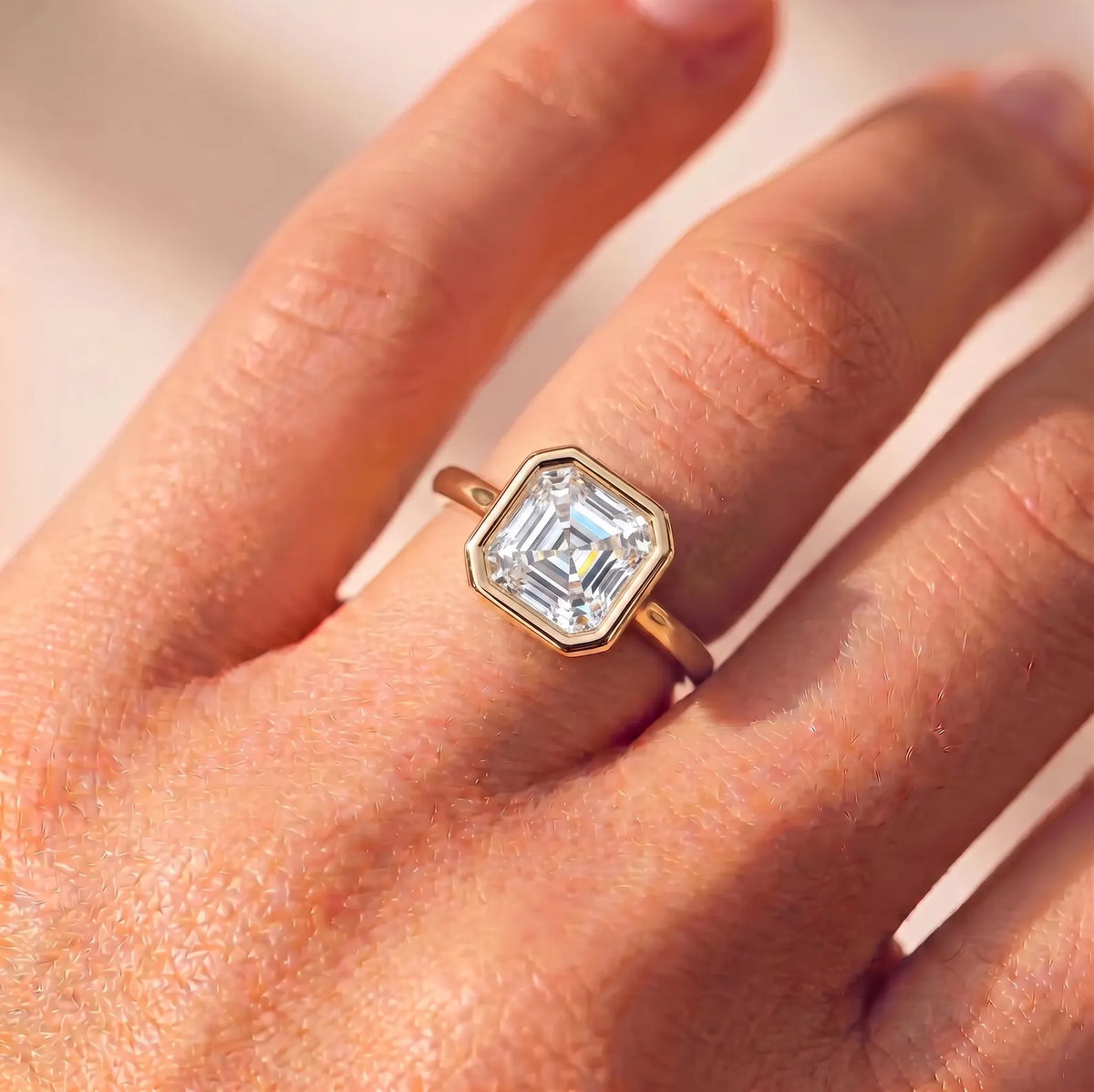 2 Carat Asscher Cut Lab Grown Diamond Bezel Ring worn on hand
