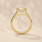 Side profile view of yellow gold bezel set Asscher cut engagement ring