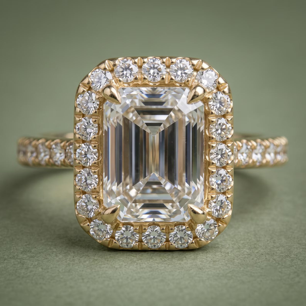 3 CT Emerald Cut Lab Grown Diamond Halo Ring Front View on Green Background