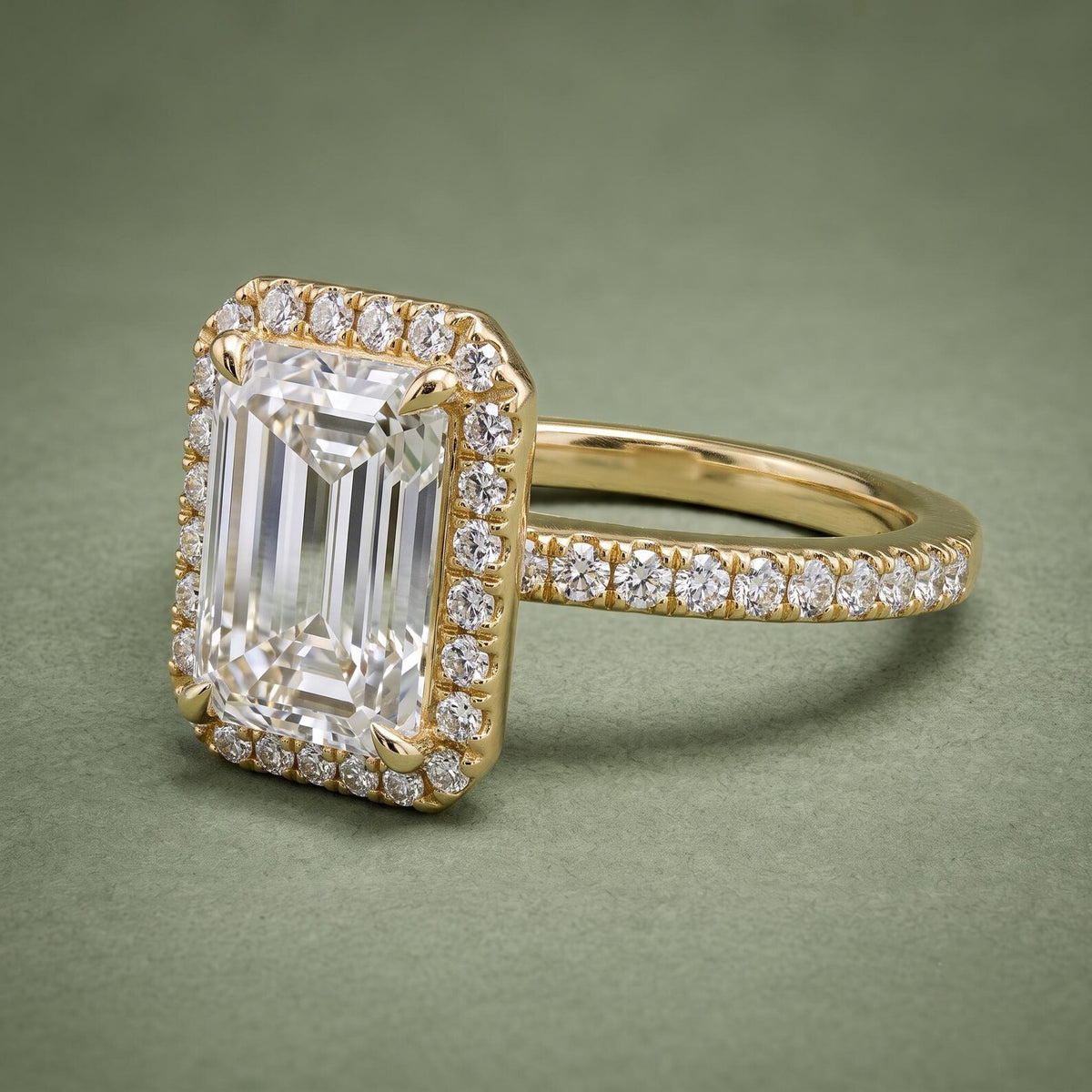 3 CT Emerald Cut Lab Grown Diamond Halo Ring side View on Green Background