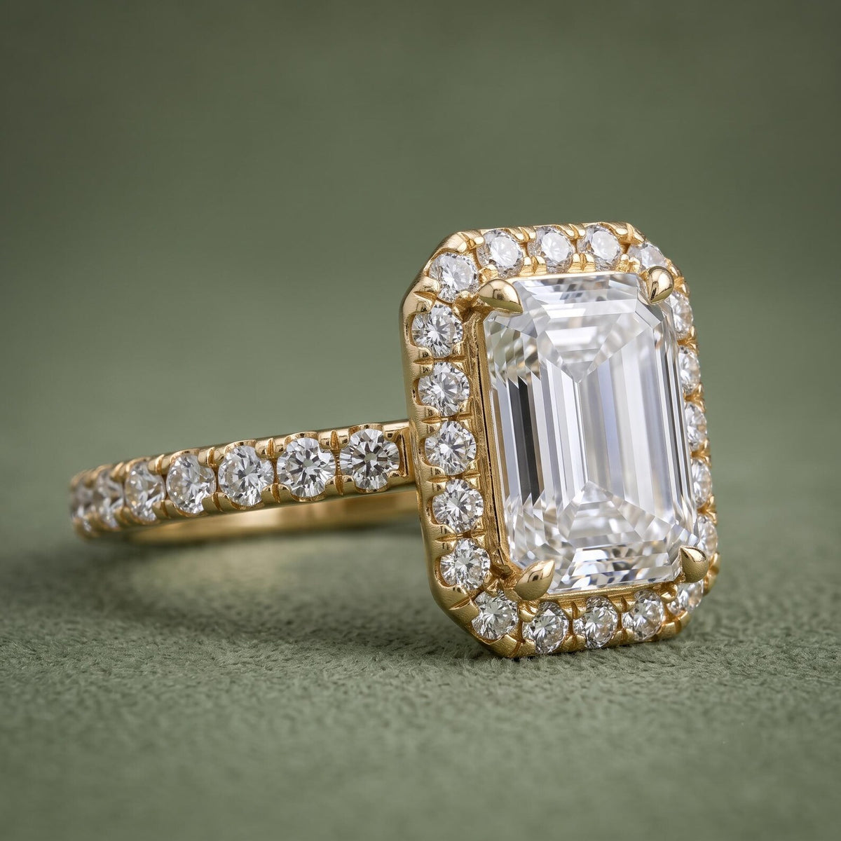 Side Angle View of 3 Carat Emerald Cut Lab Grown Diamond Halo Ring in Yellow Gold