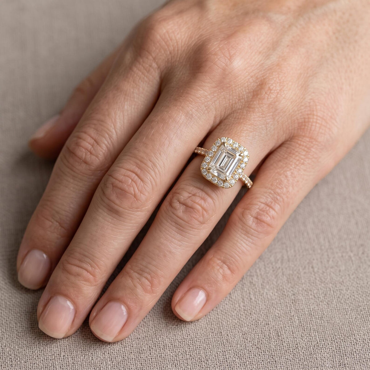 3 Carat Emerald Cut Lab Grown Diamond Halo Ring Worn on Finger