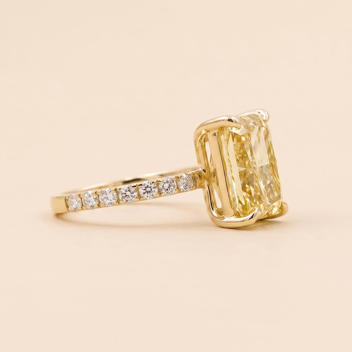 Three-Quarter Angle View of Yellow Radiant Cut Lab Grown Diamond Ring with Pave Band