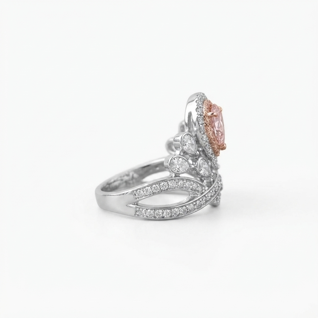 Side profile shot showcasing the height and crown design of the pink pear cut lab grown diamond ring.