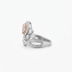 Right-side angle highlighting the sparkling band and halo settings of the pink pear cut lab grown diamond ring.