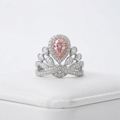Front-facing view of the luxurious pink pear cut lab grown diamond tiara ring featuring a vibrant center stone and crown motif.