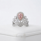 Front-facing view of the luxurious pink pear cut lab grown diamond tiara ring featuring a vibrant center stone and crown motif.