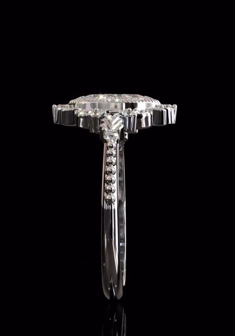 Perspective view showing leaf-sculpted shoulders and rope-bezel accent details on a marquise lab diamond ring.