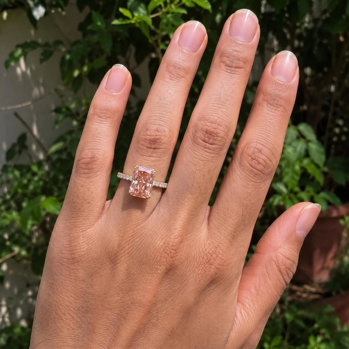 four-carat-pink-radiant-diamond-engagement-ring-top-hand-view