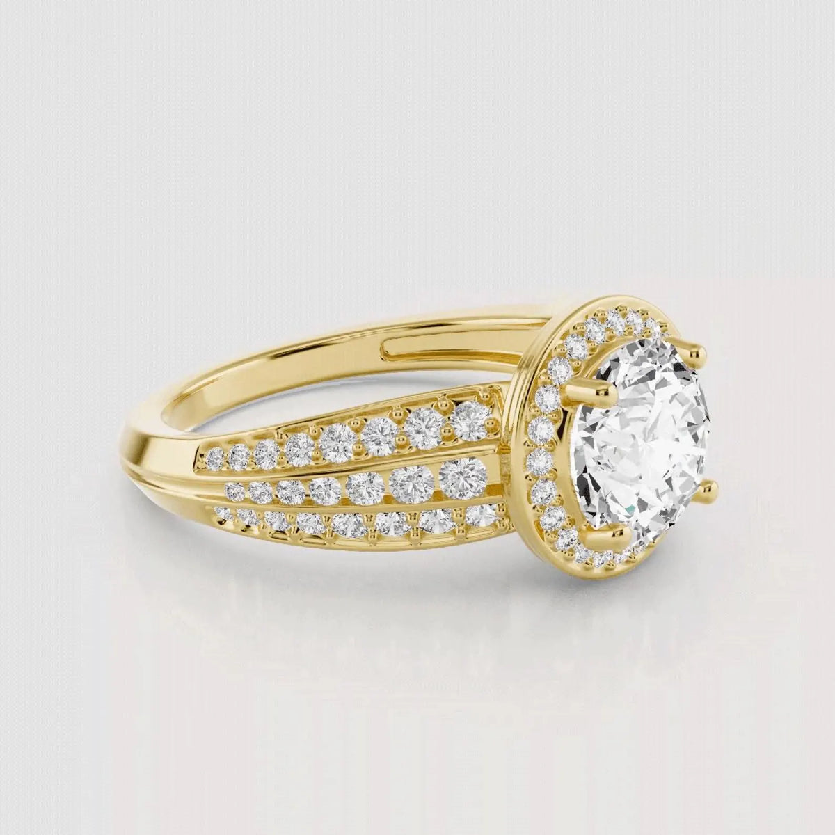 Angled view showing the triple band diamond architecture of the yellow gold halo ring.