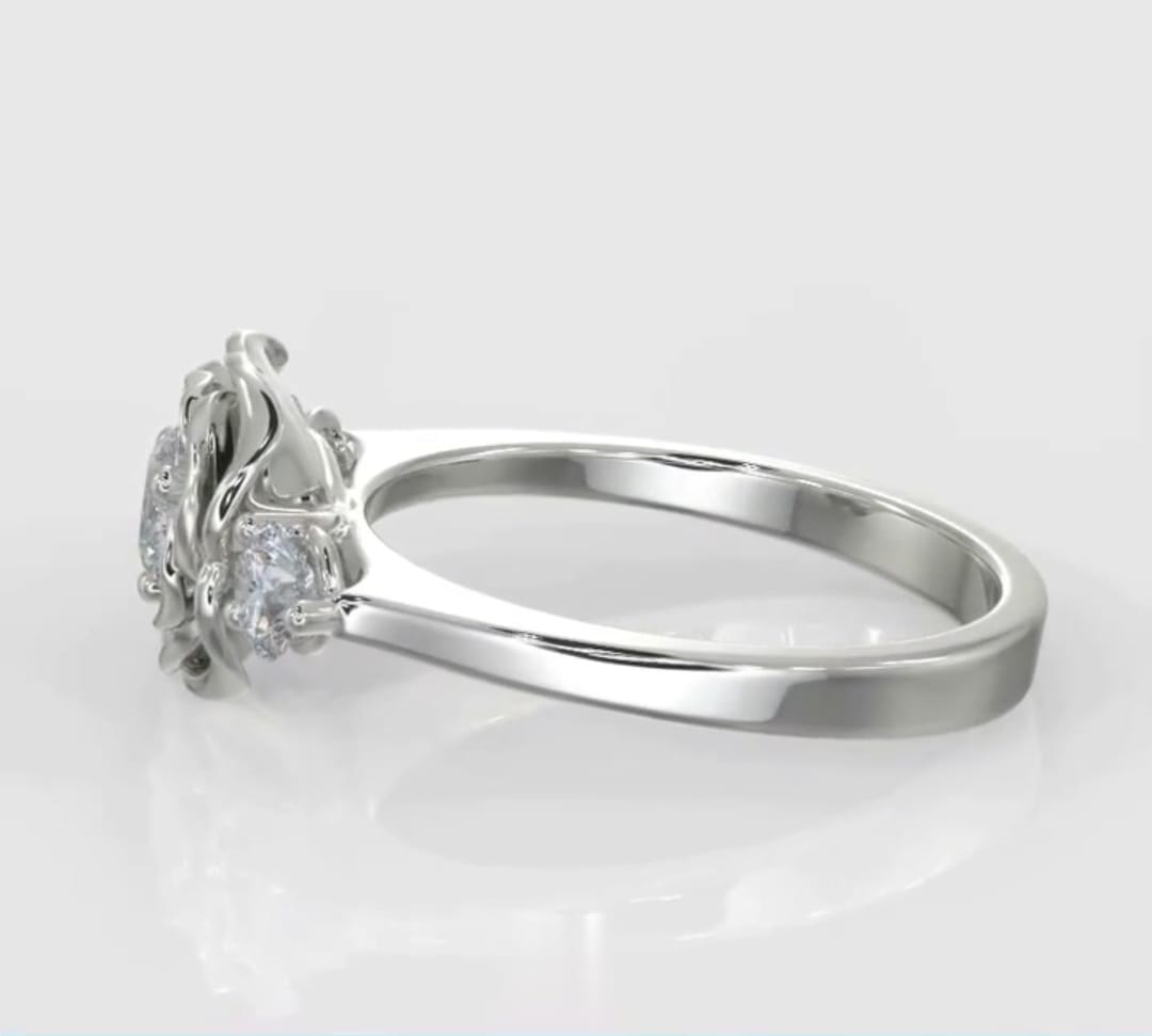 Side profile image of a round lab grown diamond set inside a sculpted metallic rose petal gallery with round side diamonds.
